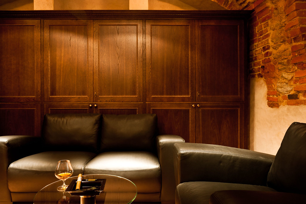 Cigar lounge with leather sofas and a glass of brandy